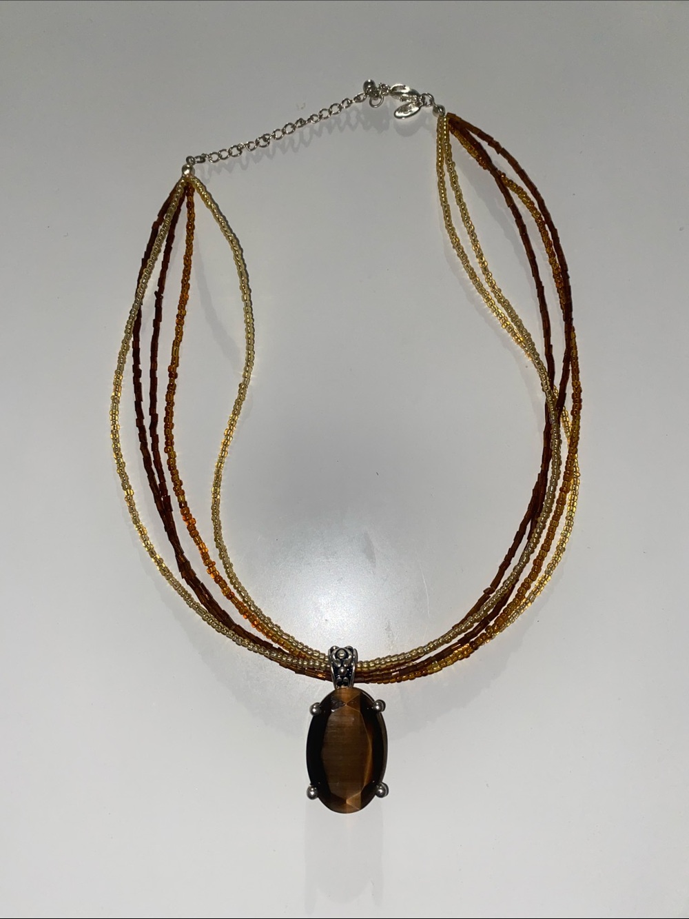 Multi-Strand Brown and Gold Beaded Necklace with Tiger Eye Style Pendant